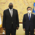 
              South Korean President Moon Jae-in, right, stands for the media with U.S. Defense Secretary Lloyd Austin before their meeting at the presidential Blue House in Seoul, South Korea, Thursday, Dec. 2, 2021. Austin said Thursday that China's pursuit of hypersonic weapons "increases tensions in the region" and vowed the U.S. would maintain its capability to deter potential threats posed by China. (Ahn Jung-hwan/Yonhap via AP)
            