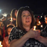 
              People participate in a candlelight vigil in the aftermath of tornadoes that tore through the region several days earlier, in Mayfield, Ky., late Tuesday, Dec. 14, 2021. (AP Photo/Gerald Herbert)
            