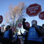 
              Protesters shout slogans during a rally outside of the Defense Ministry in Seoul, South Korea, Thursday, Dec. 2, 2021. The South Korean and U.S. defense chiefs met Thursday for their annual talks, as Washington pushes to reinforce alliances with its partners to curb mounting challenges from China and increasing North Korean nuclear threats. The letters read "Dismantle the Combined Forces Command." and "Return the Operational Control immediately." (AP Photo/Lee Jin-man)
            
