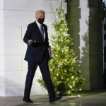 
              President Joe Biden waves as he walks to Marine One on the South Lawn of the White House in Washington, Friday, Dec. 3, 2021, as he prepares to leave for Camp David. (AP Photo/Susan Walsh)
            