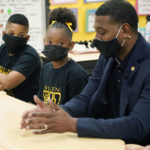 
              EPA Administrator Michael Regan, discuss with Wilkins Elementary School fourth grade students, Javaris Webster, left, and Brookelynn Knight, how the city's water problems affects many of the city's schools, Monday, Nov. 15, 2021, in Jackson, Miss. On Tuesday, Nov. 16, several schools resorted to virtual learning as the city reported low or no water pressure throughout the city and schools affected were closed for the day. Regan and others toured the school, as part of the agency's "Journey to Justice" tour through Mississippi, Louisiana and Texas, spotlighting longstanding environmental concerns in historically marginalized communities. (AP Photo/Rogelio V. Solis)
            