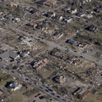 
              In this aerial photo, destruction in downtown Mayfield, Ky. is seen Sunday, Dec. 12, 2021, in the aftermath of tornadoes that tore through the region. (AP Photo/Gerald Herbert)
            