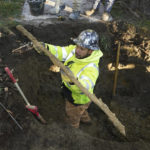 
              A cut lead pipe is pulled from a dig site for testing at a home in Royal Oak, Mich., on Tuesday, Nov. 16, 2021. Communities with lead pipes could see higher test results for lead in their tap water if a new method of water sampling goes into effect. The Detroit suburb of Royal Oak historically had low test results but it had to notify the public of a problem after the state mandated new sampling methods. (AP Photo/Carlos Osorio)
            