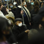 
              People, all wearing masks to prevent the spread of the COVID-19, take a ride in a metro in Istanbul, Turkey, Thursday, Dec. 2, 2021. The coronavirus's omicron variant kept a jittery world off-kilter Wednesday, as reports of infections linked to the mutant strain cropped up in more parts of the globe, and one official said that the wait for more information on its dangers felt like "an eternity". (AP Photo/Francisco Seco)
            