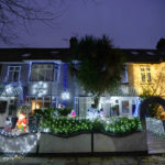 
              Houses are decorated with seasonal lights in London, Thursday, Dec. 23, 2021. The British government says it won't introduce any new coronavirus restrictions until after Christmas, and called early studies on the severity of the omicron variant encouraging. Health Secretary Sajid Javid said two studies suggesting omicron carries a significantly lower risk of hospitalization than the previously dominant delta strain was "encouraging news."(AP Photo/Kirsty Wigglesworth)
            