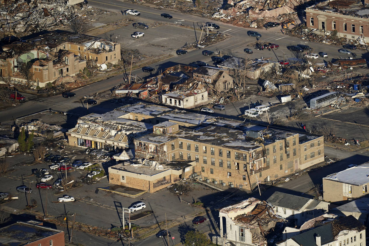 FILE - In this aerial photo, destruction from a recent tornado is seen in downtown Mayfield, Ky., S...