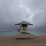 
              Dark clouds hang over a lifeguard tower on Ala Moana Beach Park, Monday, Dec. 6, 2021, in Honolulu. (AP Photo/Marco Garcia)
            