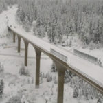 
              In this image taken from video from a Caltrans remote video traffic camera, light traffic is seen on the snow-covered Highway 267 bypass in Truckee, Calif., on Tuesday, Dec. 14, 2021. Motorists spun out on whitened mountain passes and residents wielded umbrellas that flopped in the face of fierce winds as Northern California absorbed even more rain and snow on Monday, bringing the possibility of rockslides and mudslides to areas scarred by wildfires following an especially warm and dry fall across the U.S. West. (Caltrans via AP)
            