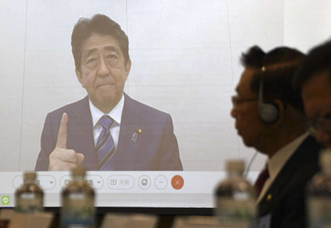 Former Japanese Prime Minister Shinzo Abe, seen on a screen, during a meeting in Taipei, Wednesday ...