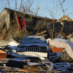 
              Damaged cars and destroyed homes are seen in the aftermath of tornadoes that tore through the region, in Mayfield, Ky., Monday, Dec. 13, 2021. (AP Photo/Gerald Herbert)
            