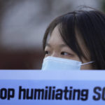 
              A protester holds a banner during a press conference outside of the Defense Ministry where place for the 53rd Security Consultative Meeting (SCM) in Seoul, South Korea, Thursday, Dec. 2, 2021. The South Korean and U.S. defense chiefs met Thursday for their annual talks, as Washington pushes to reinforce alliances with its partners to curb mounting challenges from China and increasing North Korean nuclear threats. (AP Photo/Lee Jin-man)
            