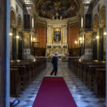 
              A man unfolds a carpet inside the Catholic Cathedral Basilica of St. Dionysius the Areopagite, one day ahead of the visit of Pope Francis in Athens, Greece, Friday, Dec. 3, 2021. Francis is on a five-day trip to Cyprus and Greece by drawing attention once again to his call for Europe to welcome migrants. (AP Photo/Yorgos Karahalis)
            