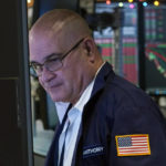 
              Trader Anthony Confusione works on the floor of the New York Stock Exchange, Wednesday, Dec. 1, 2021. Wall Street has investors on another roller-coaster ride Wednesday, as an early stock market rally lost steam in afternoon trading. (AP Photo/Richard Drew)
            