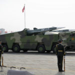 
              FILE - Chinese military vehicles carrying DF-17 ballistic missiles roll during a parade to commemorate the 70th anniversary of the founding of Communist China in Beijing, on Oct. 1, 2019. U.S. Defense Secretary Lloyd Austin said Thursday, Dec. 2, 2021, that China’s pursuit of hypersonic weapons “increases tensions in the region” and vowed the U.S. would maintain its capability to deter potential threats posed by China. (AP Photo/Ng Han Guan, File)
            