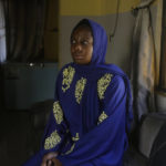 
              Amina Ahmed, the wife of Muhammad Mubarak Bala, an atheist who has been detained since April 2020, sits in her home in Abuja, Nigeria, Sunday, Nov. 21, 2021. Bala’s lengthy detention and its traumatic effect on his young family illustrate the risks of being openly faithless in African countries where belief looms large in social and political life and challenging such norms is taboo. (AP Photo/Sunday Alamba)
            