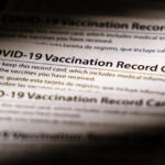 
              Shown are COVID-19 vaccination record cards in Glenside, Pa., Monday, Dec. 13, 2021. Philadelphia officials announced Monday that proof of vaccination will be required starting Jan. 3 for bars, restaurants, indoor sporting events, movie theaters and other places where people eat indoors close to each other. (AP Photo/Matt Rourke)
            