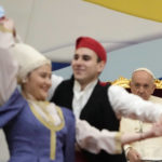 
              Pope Francis meets young people at the Saint Dionysius School of the Ursuline Sisters in Athens, Greece, Monday, Dec. 6, 2021. Francis' five-day trip to Cyprus and Greece has been dominated by the migrant issue and Francis' call for European countries to stop building walls, stoking fears and shutting out "those in greater need who knock at our door." (AP Photo/Alessandra Tarantino)
            