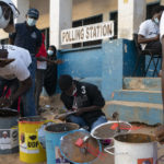 
              Electoral workers prepare the ballot drums at a polling station in Bakau, Gambia, Saturday, Dec. 4, 2021. Gambians vote in a historic election that will for the first time not have former dictator Yahya Jammeh, who ruled for 22 years, on the ballot. (AP Photo/Leo Correa)
            