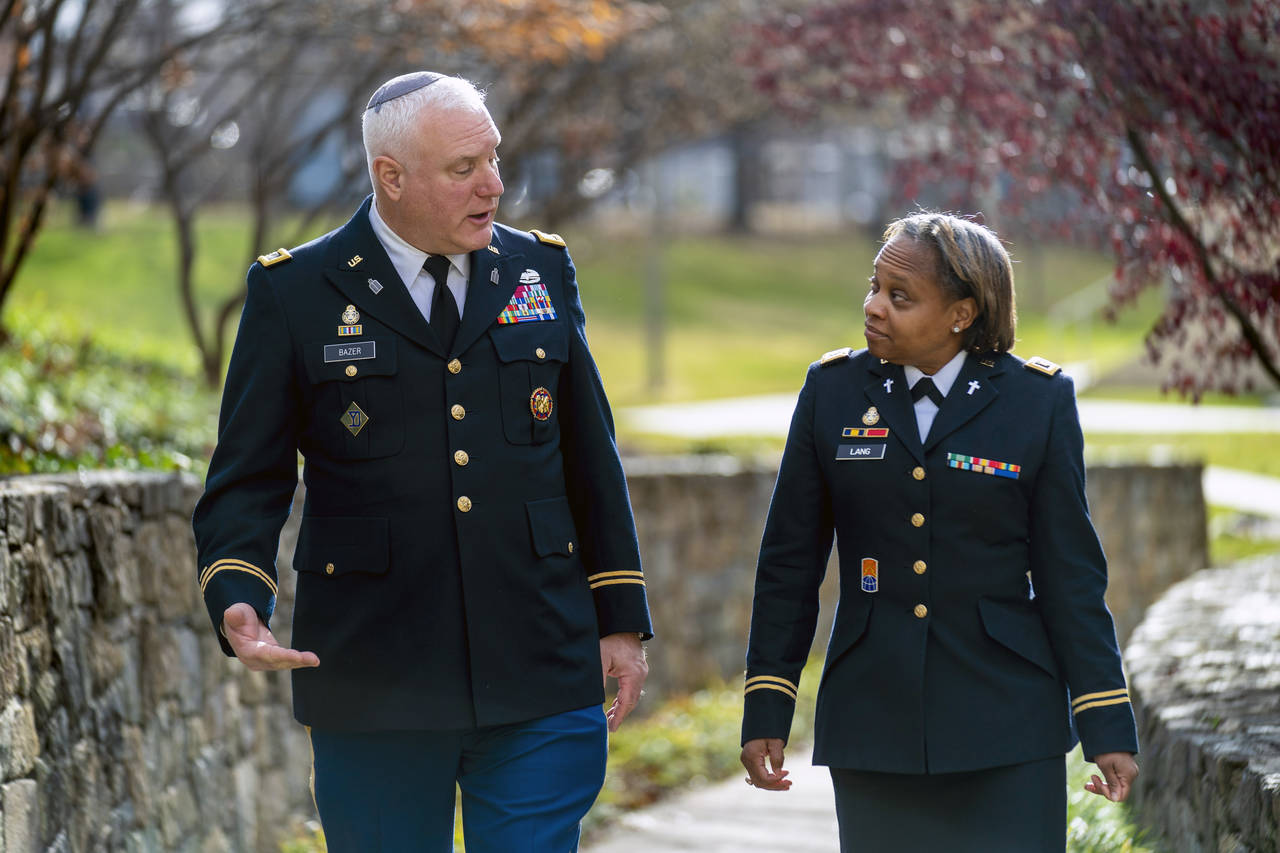 Head National Guard chaplain Col. Larry Bazer, deputy director of the chaplain office, left, and Ch...