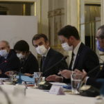 
              French President Emmanuel Macron, center, with French Minister of Marine Affairs Annick Girardin on his right, and French European Affairs Minister Clement Beaune on his left, attend a meeting, at the Elysee Palace in Paris, Friday, Dec. 17, 2021. France, December 17, 2021. Macron met with a delegation of French fishermen on Friday amid months-long, unresolved fishing dispute with Britain. (Sarah Meyssonnier, Pool photo via AP)
            