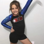 
              In this undated photo provided by Sandra Hooker, Annistyn Rackley, 9, poses for a picture while attending a cheerleading competition in Arizona. Rackley, who loved swimming, dancing and cheerleading, was among dozens of people who died because of a severe storm, Friday, Dec. 10, 2021. A tornado hit her home and splintered it less than a week after the family had moved in, according to a relative. (Meghan Rackley/Courtesy of Sandra Hooker via AP)
            