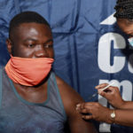 
              33-year-old Noesqui Muanza receives a dose of the Pfizer COVID-19 vaccine at the Vaccination Centre of Hope at the Cape Town International Convention Centre in Cape Town, South Africa, Friday, Dec. 3, 2021. The mass Covid-19 vaccination site is closing today after vaccinating more than 136 000 people at the Western Cape's first mass vaccination centre. (AP Photo/Nardus Engelbrecht)
            