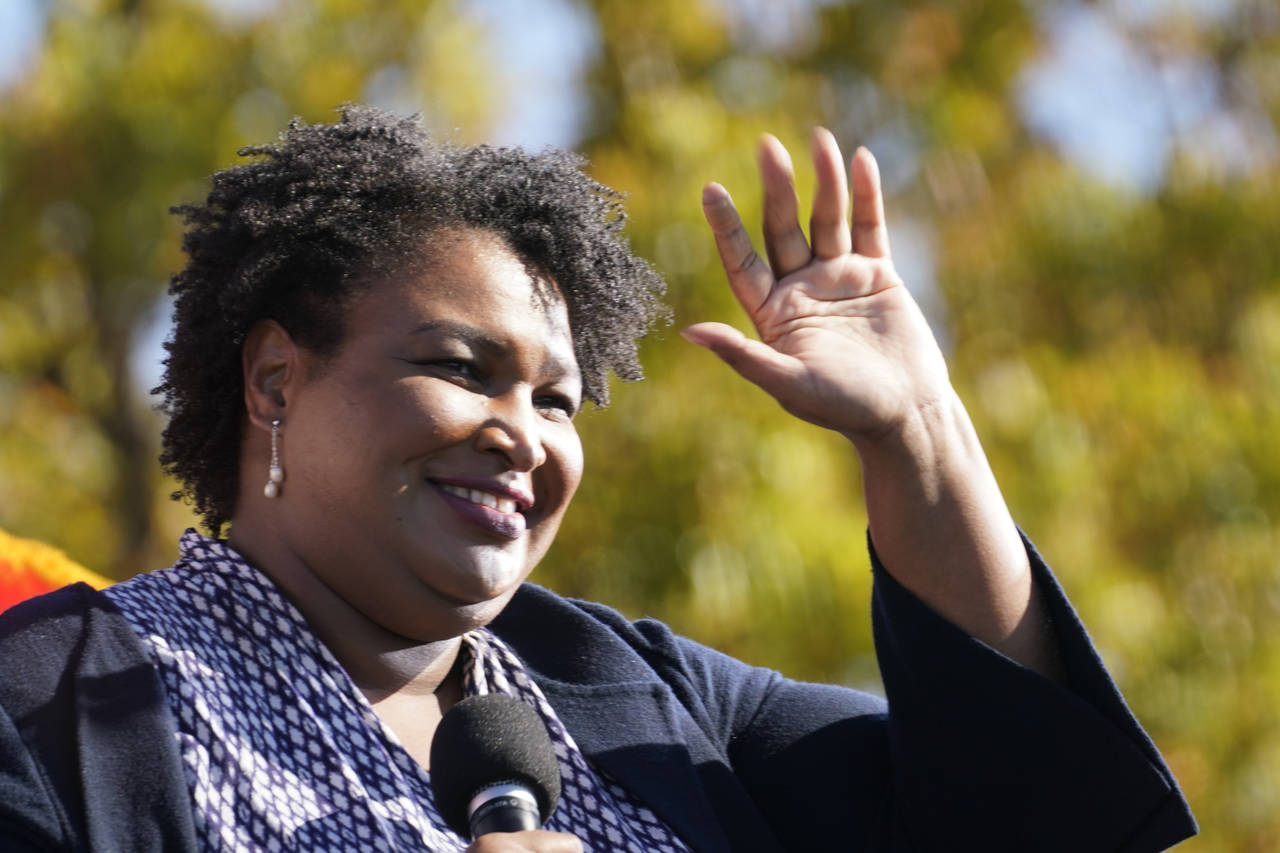 FILE - In this Monday, Nov. 2, 2020, file photo, Stacey Abrams speaks to Biden supporters as they w...