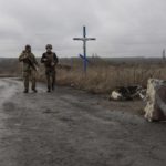 
              Ukrainian soldiers walk at the line of separation from Russia-backed rebels near the village of Nevelske in eastern Ukraine, on Friday, Dec. 10, 2021. The 7-year-old conflict has all but emptied the village, and a Russian troop buildup has stoked fears of renewed large-scale fighting, rattling already-nervous residents. (AP Photo/Andriy Dubchak)
            