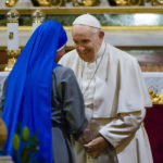
              Pope Francis talks to a nun during a meeting with members of the Greece religious community at the St. Dionysius Cathedral in Athens, Greece, Saturday, Dec. 04, 2021. Pope Francis arrived in Athens on Saturday for the second leg of a five-day visit to Cyprus and Greece aimed at bolstering recently mended ties between the Vatican and Greek Orthodox churches. (AP Photo/Alessandra Tarantino)
            