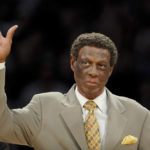 
              FILE - Elgin Baylor waves as he is honored along with other members of the 1974 Los Angeles Lakers Championship team, at halftime of an NBA basketball game between the Houston Rockets and the Lakers in Los Angeles, April 6, 2012. Elgin Baylor, the Lakers' 11-time NBA All-Star, died, March 22, 2021, of natural causes. He was 86. (AP Photo/Gus Ruelas, File)
            