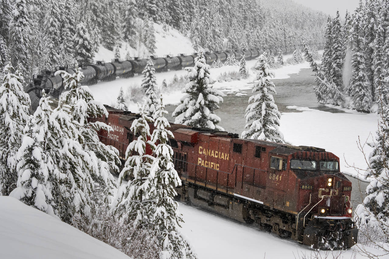 A Canadian Pacific train hauls oil westward through Banff National Park, Alberta, Canada, Sunday, N...