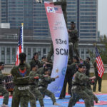 
              South Korean 2nd army command's soldiers perform taekwondo as U.S. Secretary of Defense Lloyd J. Austin III and South Korean Defense Minister Suh Wook (both not pictured) watch during a ceremony of the SCM (Security Consultative Meeting) at the great parade ground in the Ministry of National Defense in Seoul, South Korea, Thursday, Dec. 2, 2021. U.S. Defense Secretary Lloyd Austin said Thursday that China’s pursuit of hypersonic weapons “increases tensions in the region” and vowed the U.S. would maintain its capability to deter potential threats posed by China. (Song Kyung-seok/Pool Photo via AP)
            