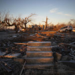 
              The front steps of a house are all that remains after a tornado in Dawson Springs, Ky., Sunday, Dec. 12, 2021. A monstrous tornado, carving a track that could rival the longest on record, ripped across the middle of the U.S. on Friday. (AP Photo/Michael Clubb)
            