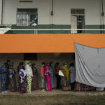 
              People line up to cast their ballot for Gambia's presidential elections, in Banjul, Gambia, Saturday, Dec. 4, 2021. Lines of voters formed outside polling stations in Gambia’s capital as the nation holds a presidential election. The election on Saturday is the first in decades without former dictator Yahya Jammeh as a candidate. (AP Photo/Leo Correa)
            