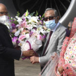 
              In this photograph released by India’s Presidential Palace, Indian President Ram Nath Kovind, left is received by Bangladesh President Mohammad Abdul Hamid, center at the Hazrat Shahjalal International Airport in Dhaka, Bangladesh, Wednesday, Dec.15, 2021. Kovind is in Dhaka to attend celebrations marking the 50th anniversary of the end of Bangladesh’s nine-month long Liberation War in 1971. (Indian Presidential Palace via AP)
            