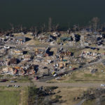 
              In this aerial photo, destruction is seen along Reelfoot Lake in the aftermath of tornadoes that through the region, in Samburg, Tenn., Sunday, Dec. 12, 2021. (AP Photo/Gerald Herbert)
            