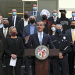 
              Joined by business owners and community leaders, Los Angeles Mayor Eric Garcetti, center, speaks during a news conference outside the Los Angeles Police Headquarters in Los Angeles, Thursday, Dec. 2, 2021. Authorities in Los Angeles on Thursday announced arrests in recent smash-and-grab thefts at stores, part of a rash of organized retail crime in California. (AP Photo/Jae C. Hong)
            