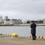 
              A man stands on Dec. 14, 2021, at a port in Niigata, northwest of Japan where Eiko Kawasaki had left for North Korea in 1960 at the age of 17, following the promise of free education and a better life. Kawasaki was among some 93,000 ethnic Korean residents in Japan and their relatives who joined a resettlement program led by North Korea only to find the opposite of what was promised. Most were put to brutal manual labor at mines, in forests and on farms and faced discrimination because of Japan's past colonization of the Korean Peninsula. (AP Photo/Chisato Tanaka)
            