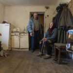 
              Halyna Moroka and her husband, Serhii, rest at their home in the village of Nevelske in eastern Ukraine, Friday, Dec. 10, 2021. The 7-year-old conflict between Russia-backed separatists and Ukrainian forces has all but emptied the village. “We have grown accustomed to the shelling,” said Moroka, 84, who has stayed in Nevelske with her disabled son. (AP Photo/Andriy Dubchak)
            