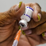 
              A syringe is prepared with the Pfizer COVID-19 vaccine at a vaccination clinic at the Keystone First Wellness Center in Chester, Pa., Wednesday, Dec. 15, 2021. (AP Photo/Matt Rourke)
            