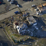 
              In this aerial photo, destruction from a recent tornado is seen in downtown Mayfield, Ky., Sunday, Dec. 12, 2021. (AP Photo/Gerald Herbert)
            