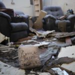 
              A pillow with the words "Home our happy place" sits among the remains of a destroyed house after a tornado in Dawson Springs, Ky., Sunday, Dec. 12, 2021.  A monstrous tornado, carving a track that could rival the longest on record, ripped across the middle of the U.S. on Friday. (AP Photo/Michael Clubb)
            