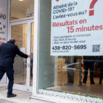 
              People enter a COVID-19 rapid testing business in Montreal, Saturday, Dec. 4, 2021. (Graham Hughes/The Canadian Press via AP)
            