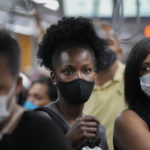 
              Commuters wear protective face masks as they walk through a subway station, in Sao Paulo, Brazil, Wednesday, Dec. 1, 2021, amid the COVID-19 pandemic. Brazil joined the widening circle of countries to report cases of the omicron variant. (AP Photo/Andre Penner)
            