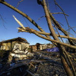 
              Destroyed homes ad trees are seen in the aftermath of tornadoes that tore through the region, in Mayfield, Ky., Monday, Dec. 13, 2021. (AP Photo/Gerald Herbert)
            