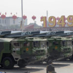 
              FILE - Chinese military vehicles carrying DF-17 roll during a parade to commemorate the 70th anniversary of the founding of Communist China in Beijing, Tuesday, Oct. 1, 2019. U.S. Defense Secretary Lloyd Austin said Thursday, Dec. 2, 2021, that China’s pursuit of hypersonic weapons “increases tensions in the region” and vowed the U.S. would maintain its capability to deter potential threats posed by China. (AP Photo/Ng Han Guan, File)
            