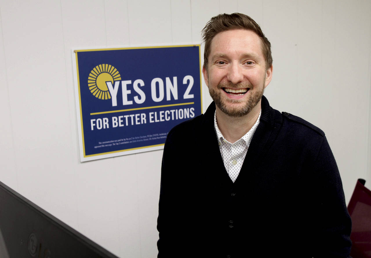 Former Alaska lawmaker Jason Grenn poses for a photo at his office in Anchorage, Alaska, on Friday,...