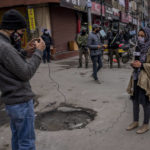 
              Kashmiri Journalists work during surprise search of pedestrians by security forces in Srinagar, Indian controlled Kashmir, Friday, Jan. 21, 2022. Local Kashmiri reporters were often the only eyes on the ground for the global audiences, particularly after New Delhi barred foreign journalists from the region without official approval a few years ago. Most of the coverage has focused on the Kashmir conflict and government crackdowns. Authorities are now seeking to control any narrative seen opposite to the broad consensus in India that the region is an integral part of the country.  (AP Photo/Dar Yasin)
            