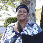 
              Vanessa Akinniyi poses front of her doctor's office in Jacksonville, Fla., Thursday, Jan. 13, 2022. Akinniyi was stuck in denial about diabetes until a care manager from her health insurer coaxed her out. The nurse fed Akinniyi information about her condition and talked about potential problems she could run into like vision loss. (AP Photo/Gary McCullough)
            