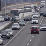 
              A car drives in the opposite direction, where a highway was blocked, during a protest in Belgrade, Serbia, Saturday, Jan. 15, 2022. Hundreds of environmental protesters demanding cancelation of any plans for lithium mining in Serbia took to the streets again, blocking roads and, for the first time, a border crossing. Traffic on the main highway north-south highway was halted on Saturday for more than one hour, along with several other roads throughout the country, including one on the border with Bosnia. (AP Photo/Darko Vojinovic)
            